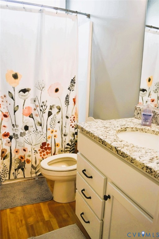 288 Moore Road Farmville, VA 23901 - Photo 27 of 33 a bathroom with a granite countertop sink and a toilet