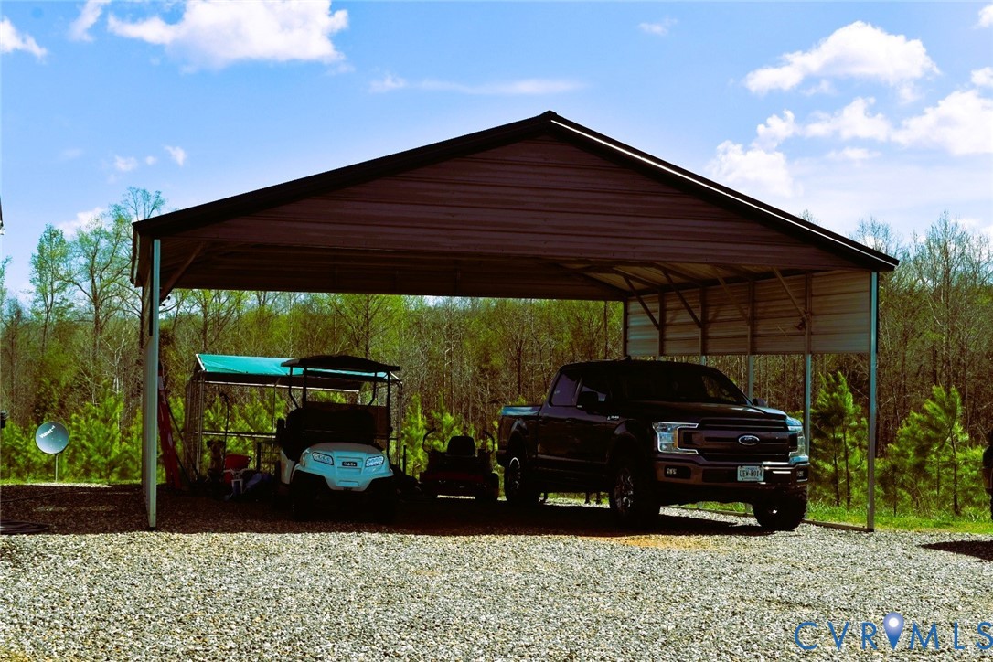 288 Moore Road Farmville, VA 23901 - Photo 32 of 33 a view of house and a car parked in the yard
