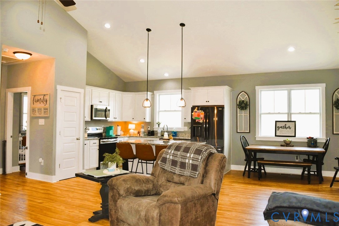 288 Moore Road Farmville, VA 23901 - Photo 10 of 33 a living room with furniture kitchen view and a chandelier