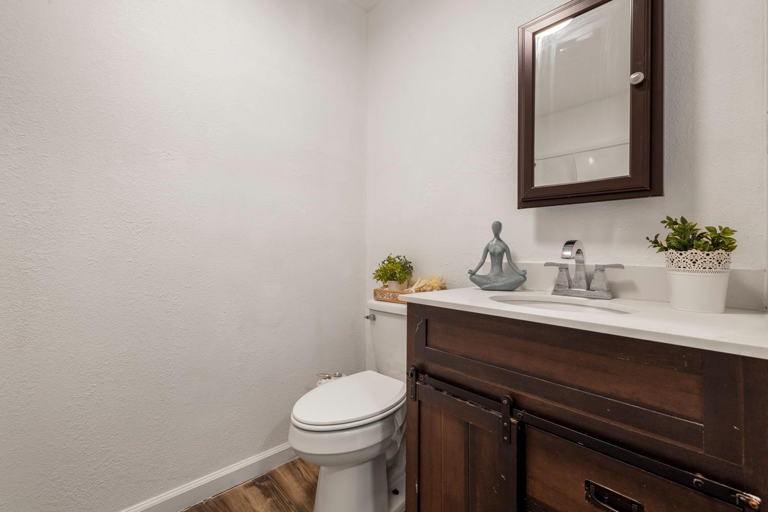 2621 Prescott Road, Unit 79 Modesto, CA 95350 - Photo 37 of 41 a bathroom with a sink vanity and a toilet