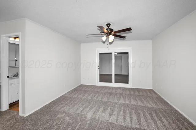 a view of an empty room with a bathroom