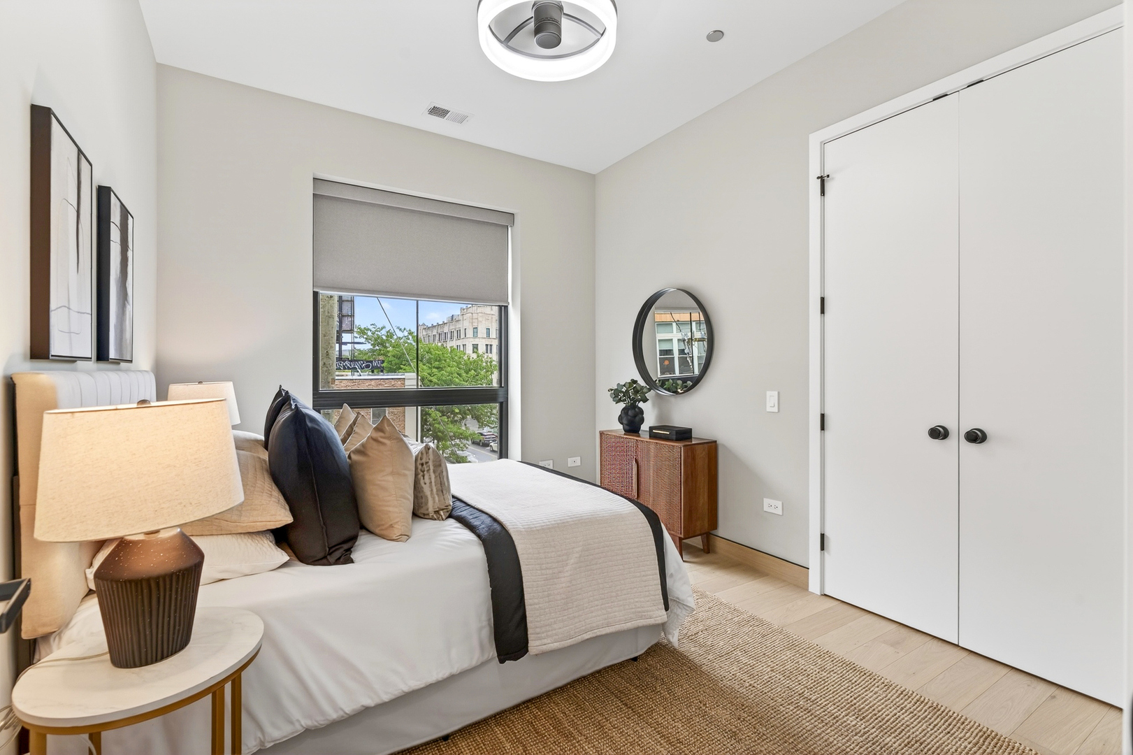 2024 West Irving Park Road, Unit 302 Chicago, IL 60618 - Photo 19 of 32 a bedroom with a bed and a window