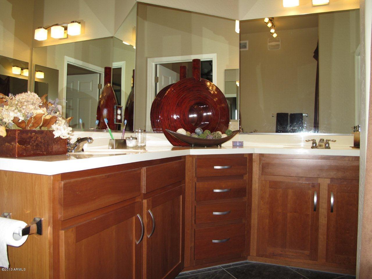 3330 South Gilbert Road, Unit 2014 Chandler, AZ 85286 - Photo 15 of 30 a bathroom with a sink double vanity and a mirror