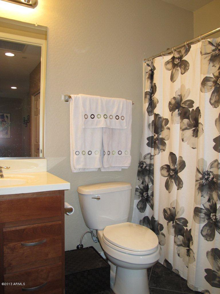 3330 South Gilbert Road, Unit 2014 Chandler, AZ 85286 - Photo 18 of 30 a bathroom with a sink toilet and shower