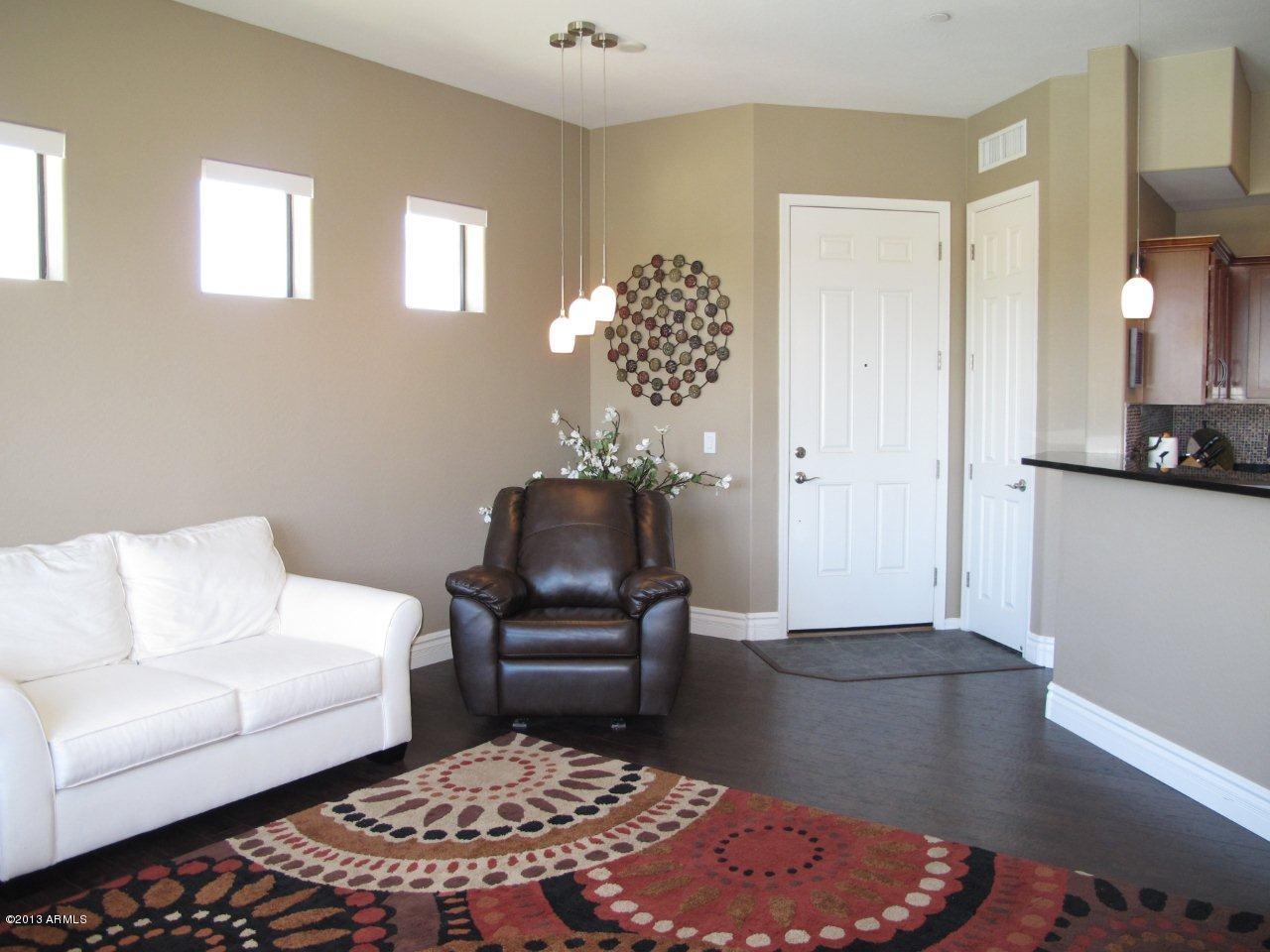 3330 South Gilbert Road, Unit 2014 Chandler, AZ 85286 - Photo 2 of 30 a living room with furniture and wooden floor