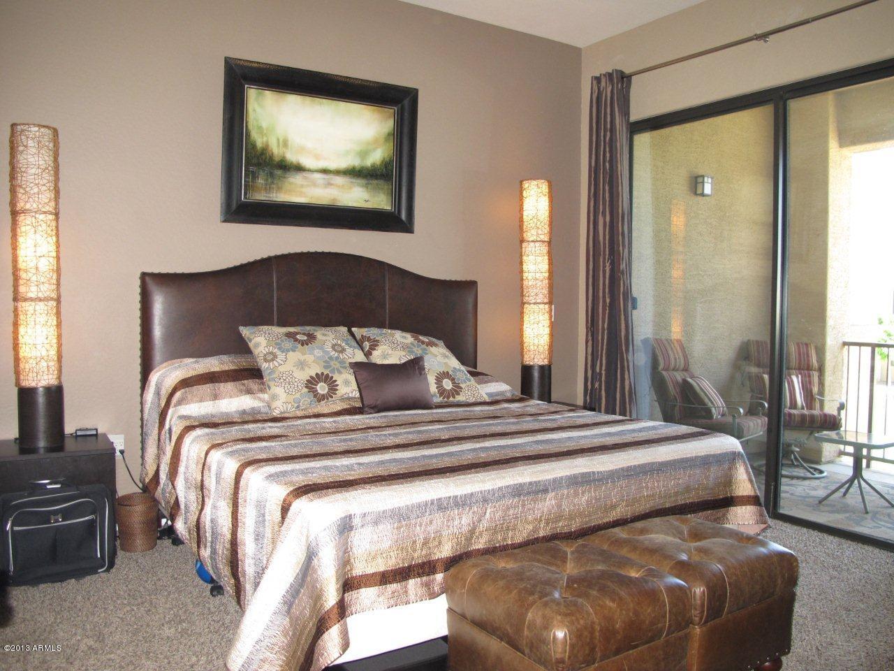 3330 South Gilbert Road, Unit 2014 Chandler, AZ 85286 - Photo 10 of 30 a bedroom with a bed and glass window