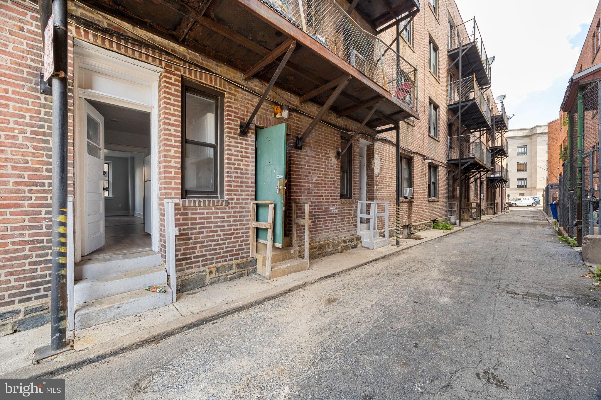 0 Garrett Road, Unit F101 Upper Darby, PA 19082 - Photo 12 of 22 a view of a house with a wooden bench