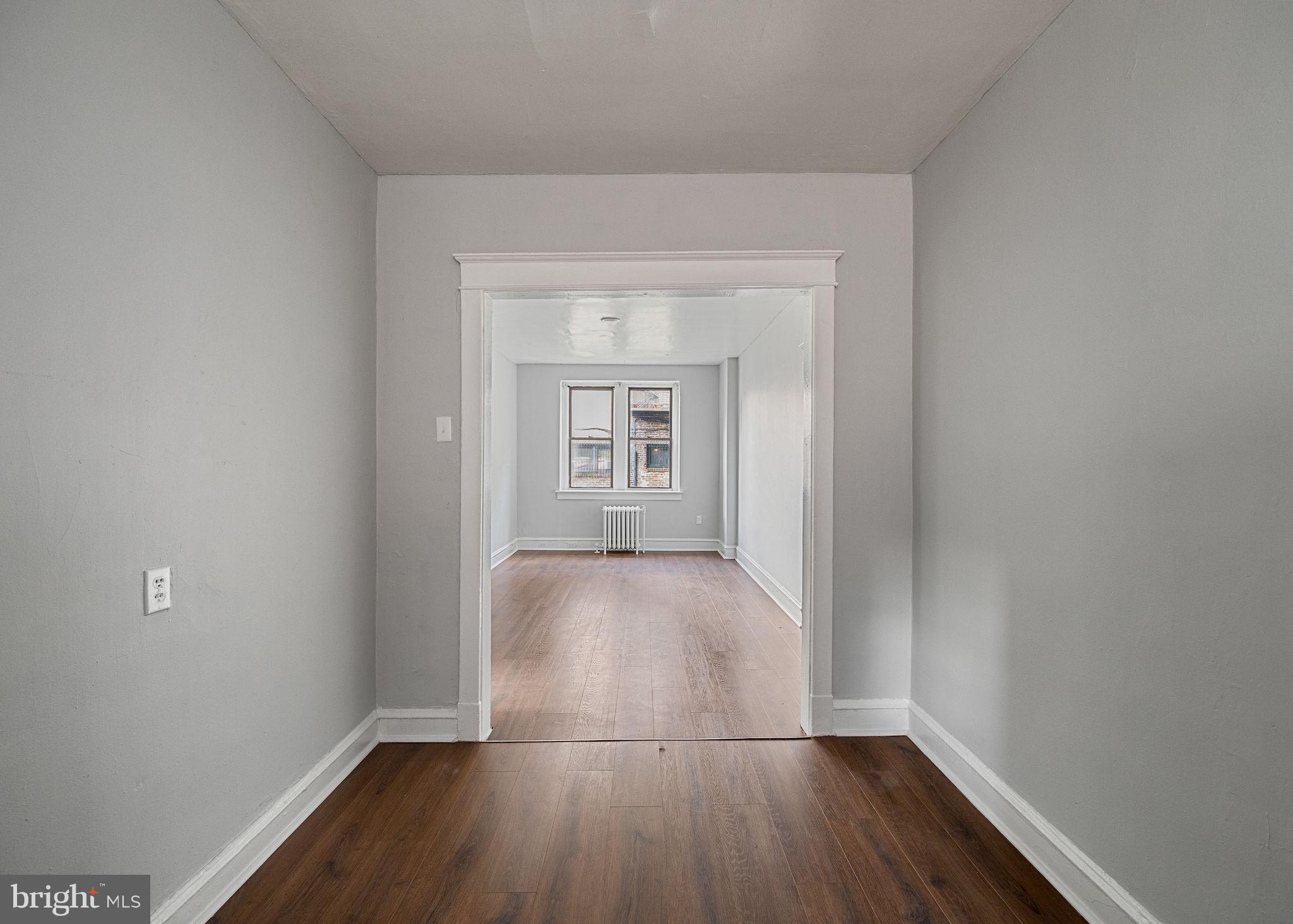 0 Garrett Road, Unit F101 Upper Darby, PA 19082 - Photo 13 of 22 wooden floor in a empty room