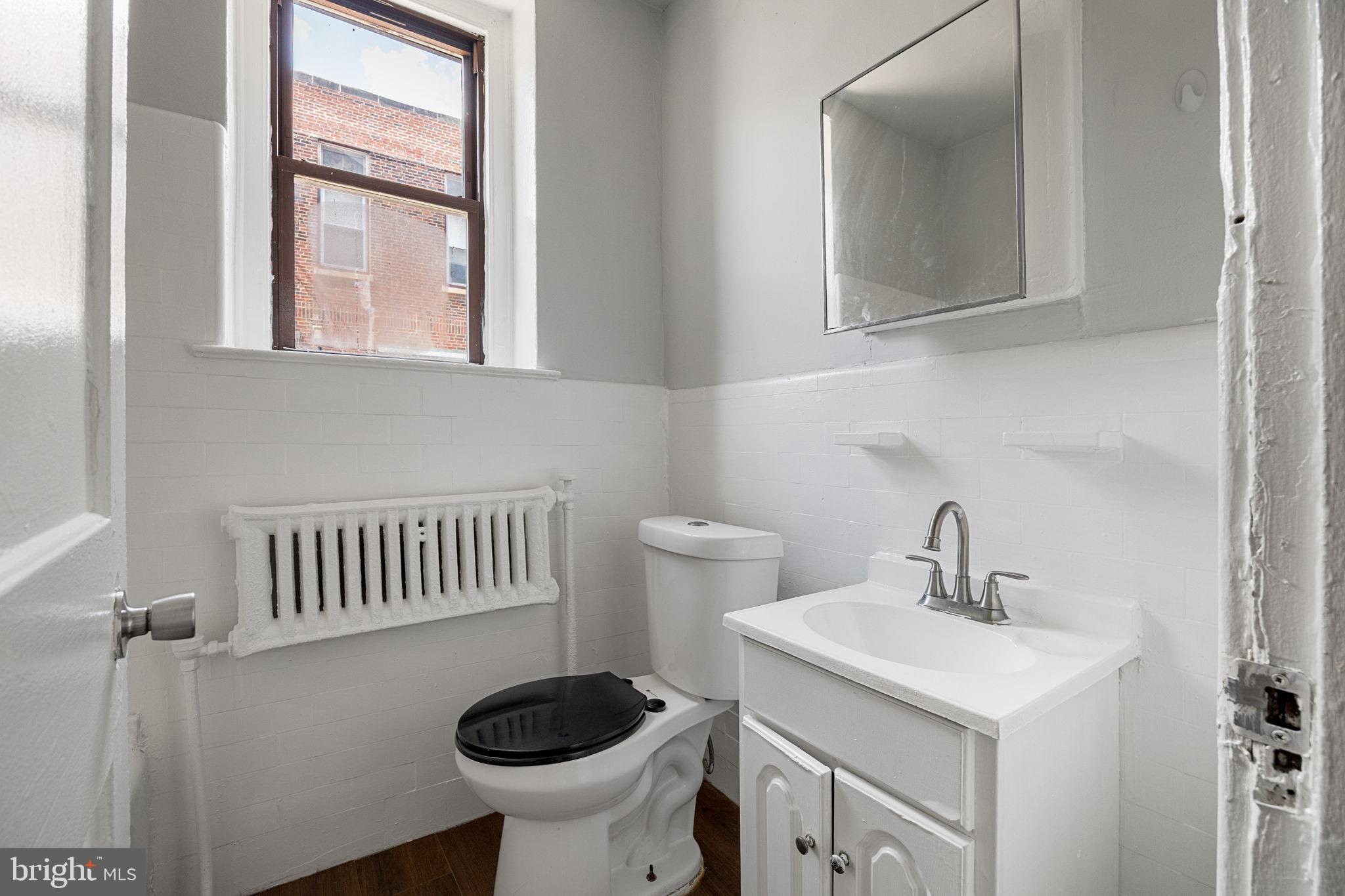0 Garrett Road, Unit F101 Upper Darby, PA 19082 - Photo 18 of 22 a bathroom with a sink and a toilet
