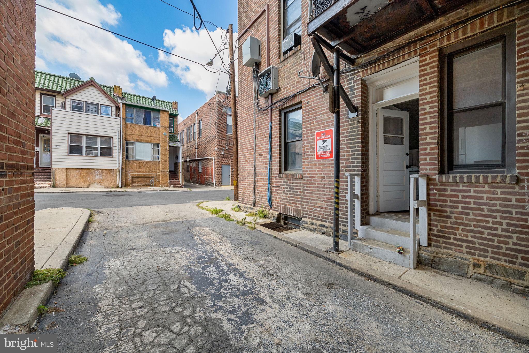 0 Garrett Road, Unit F101 Upper Darby, PA 19082 - Photo 19 of 22 a view of a brick building with many windows