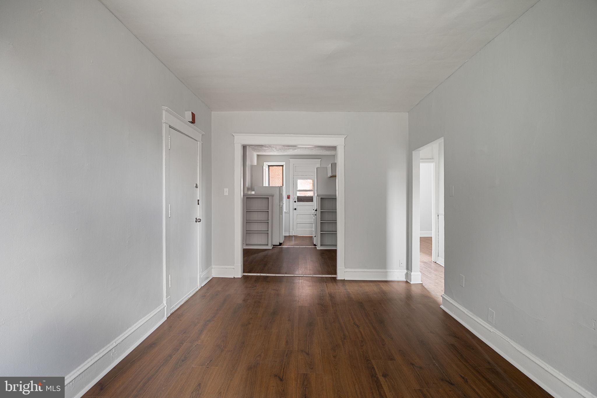 0 Garrett Road, Unit F101 Upper Darby, PA 19082 - Photo 8 of 22 a view of empty room with wooden floor