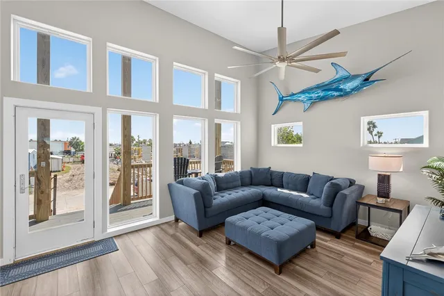 a living room with furniture and a large window