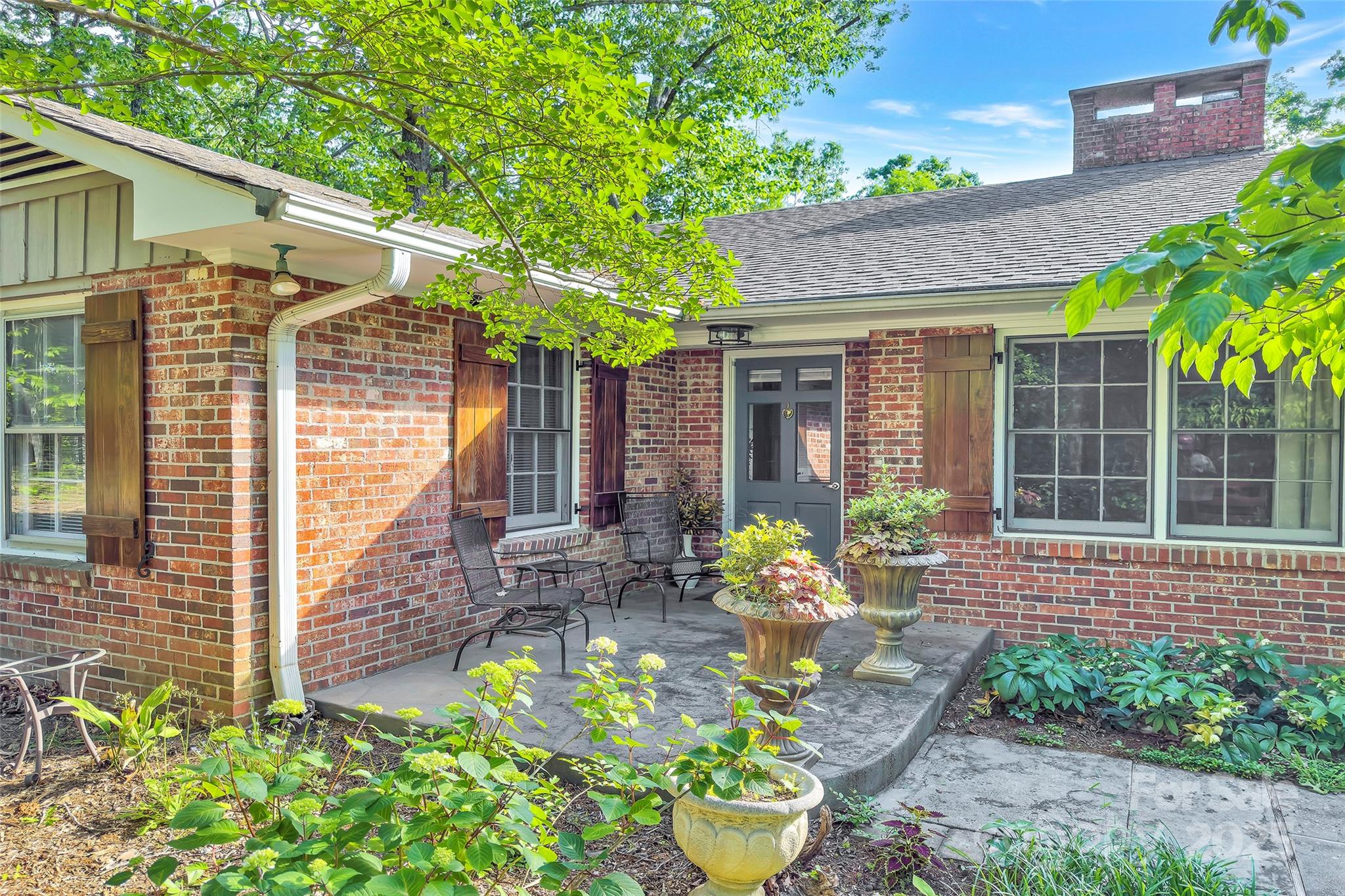 7 Hearthstone Lane Landrum, SC 29356 - Photo 19 of 43 a front view of a house having patio