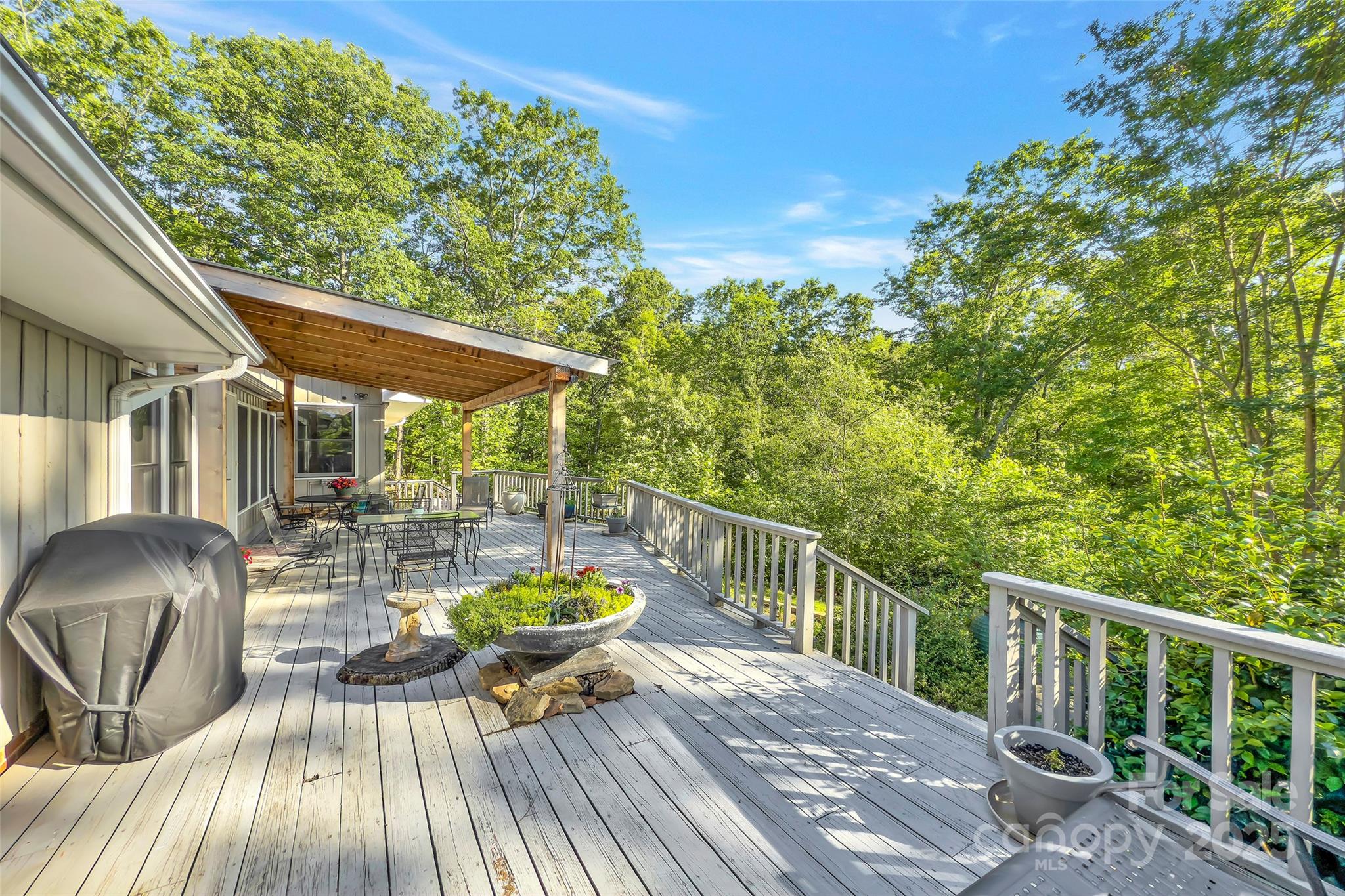 7 Hearthstone Lane Landrum, SC 29356 - Photo 20 of 43 a view of balcony with chairs and wooden floor
