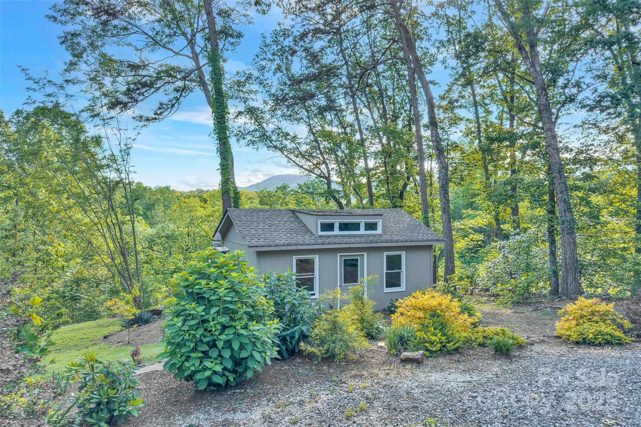 7 Hearthstone Lane Landrum, SC 29356 - Photo 22 of 43 a front view of a house with garden