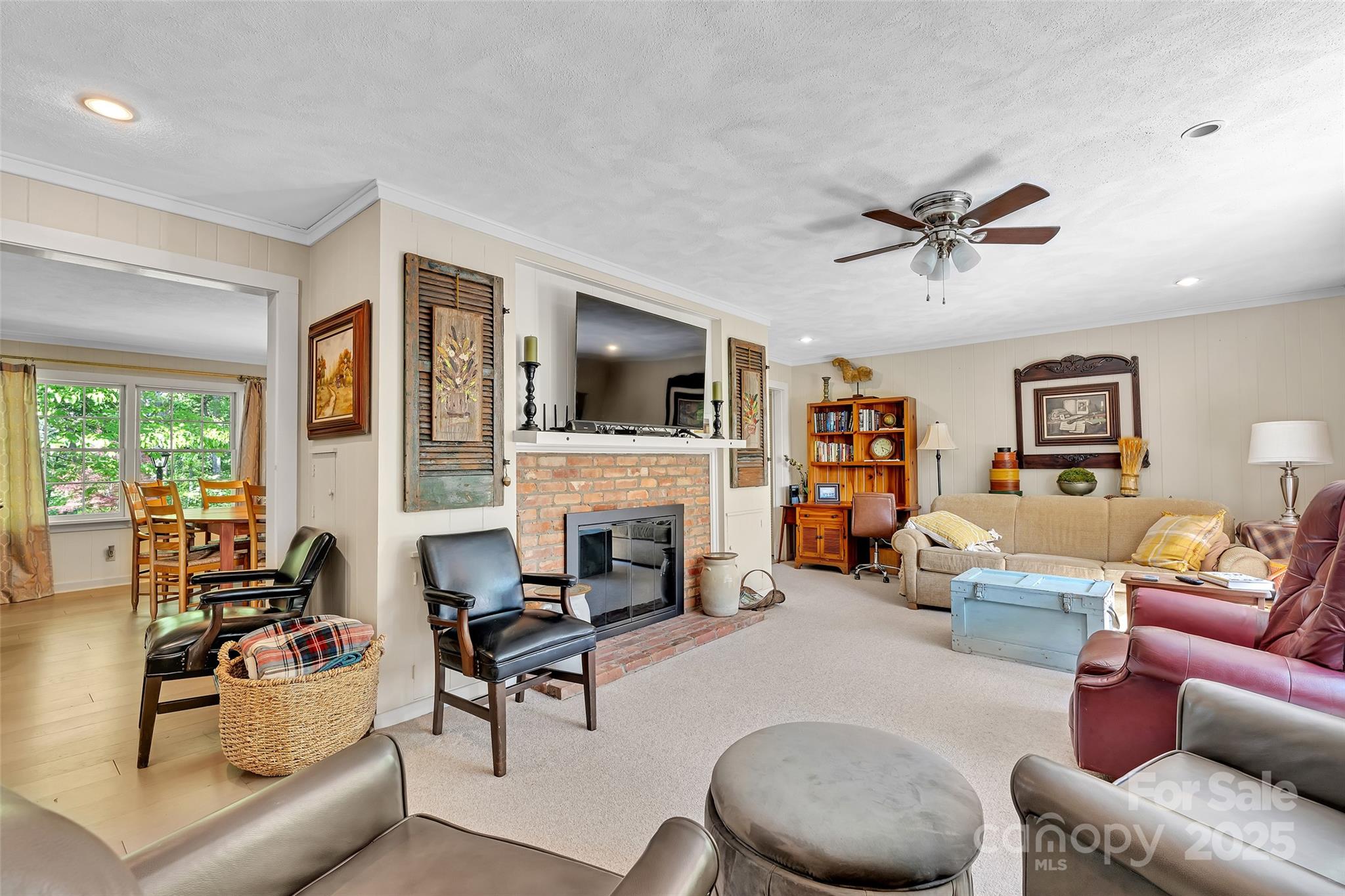 7 Hearthstone Lane Landrum, SC 29356 - Photo 27 of 43 a living room with furniture fireplace and a large window