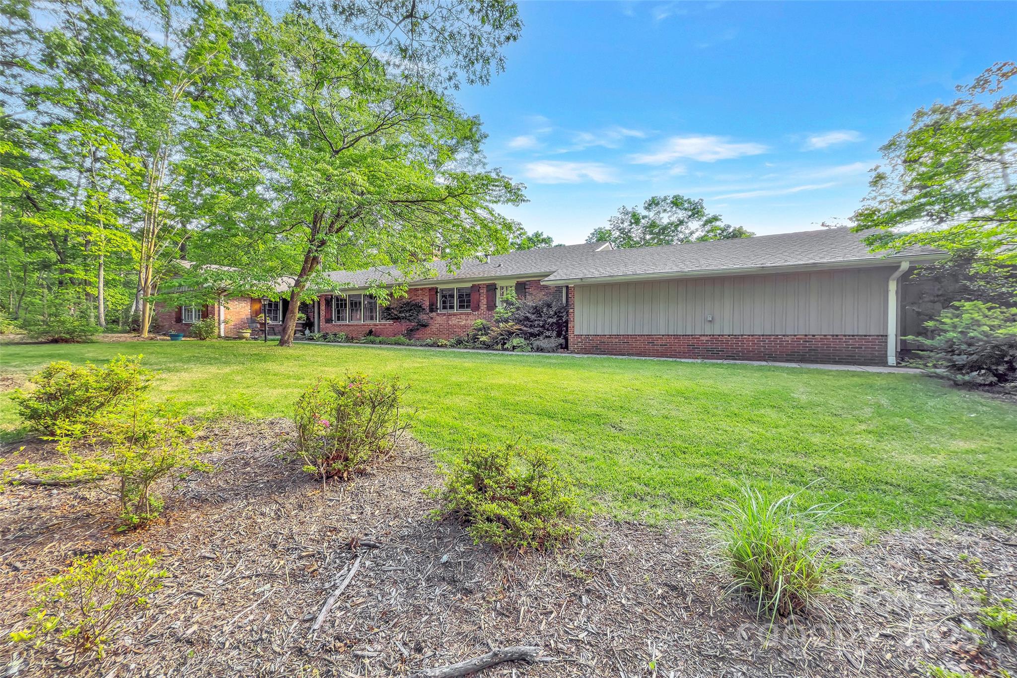 7 Hearthstone Lane Landrum, SC 29356 - Photo 32 of 43 a view of a house with a yard and sitting area