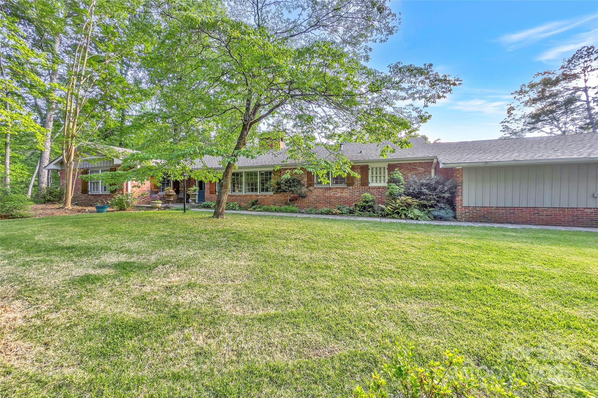 7 Hearthstone Lane Landrum, SC 29356 - Photo 33 of 43 a front view of a house with garden