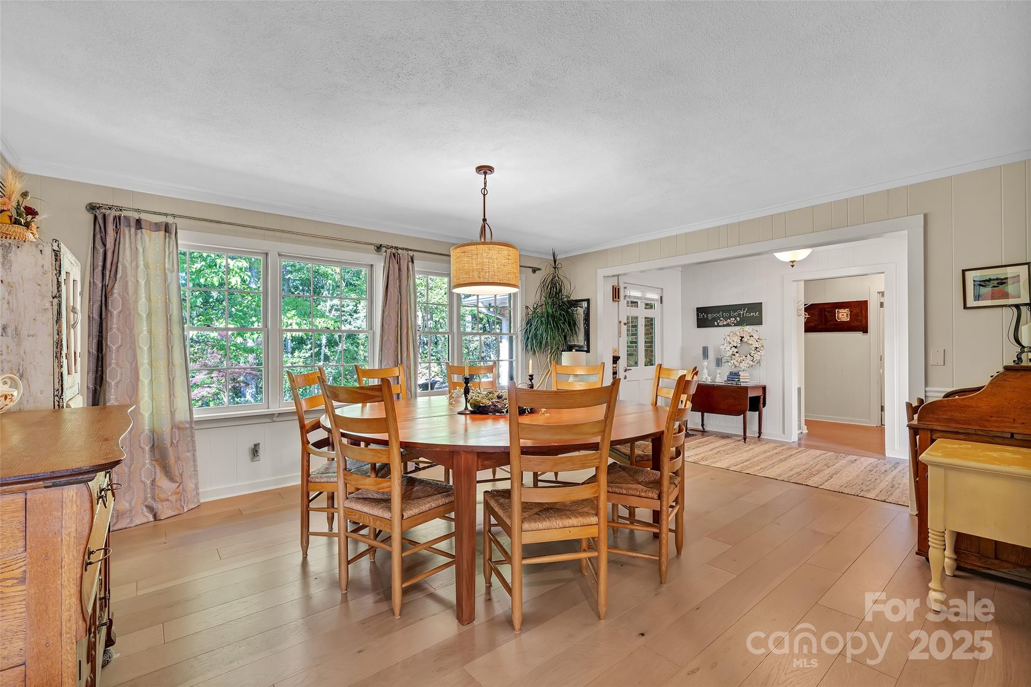 7 Hearthstone Lane Landrum, SC 29356 - Photo 8 of 43 a dining room with furniture window and wooden floor