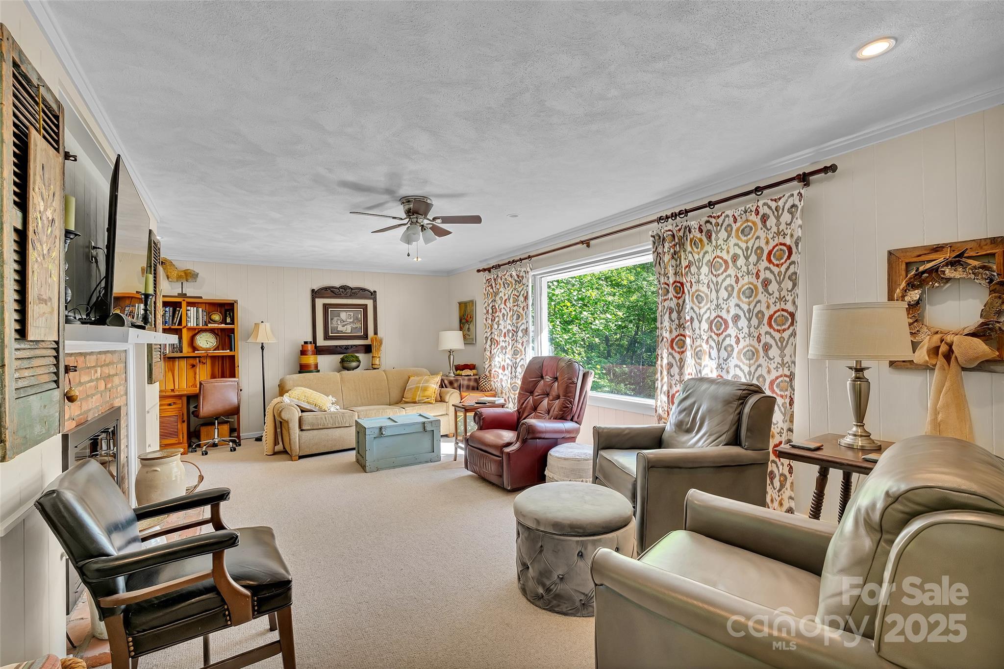 7 Hearthstone Lane Landrum, SC 29356 - Photo 10 of 43 a living room with furniture and a large window