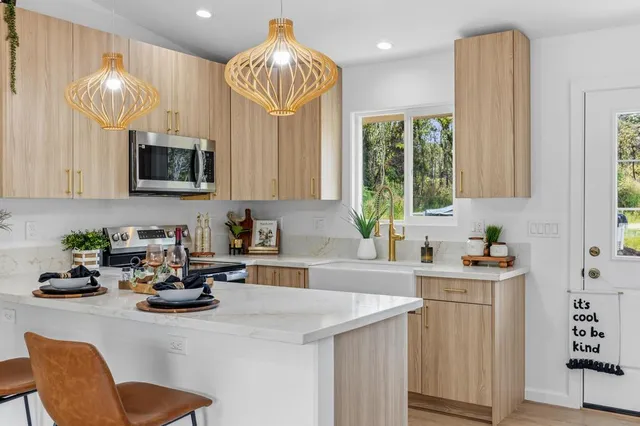 a kitchen with a sink cabinets and window