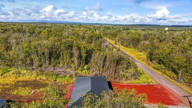 a backyard of a house with yard and outdoor seating