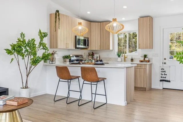 a kitchen with a sink cabinets and window