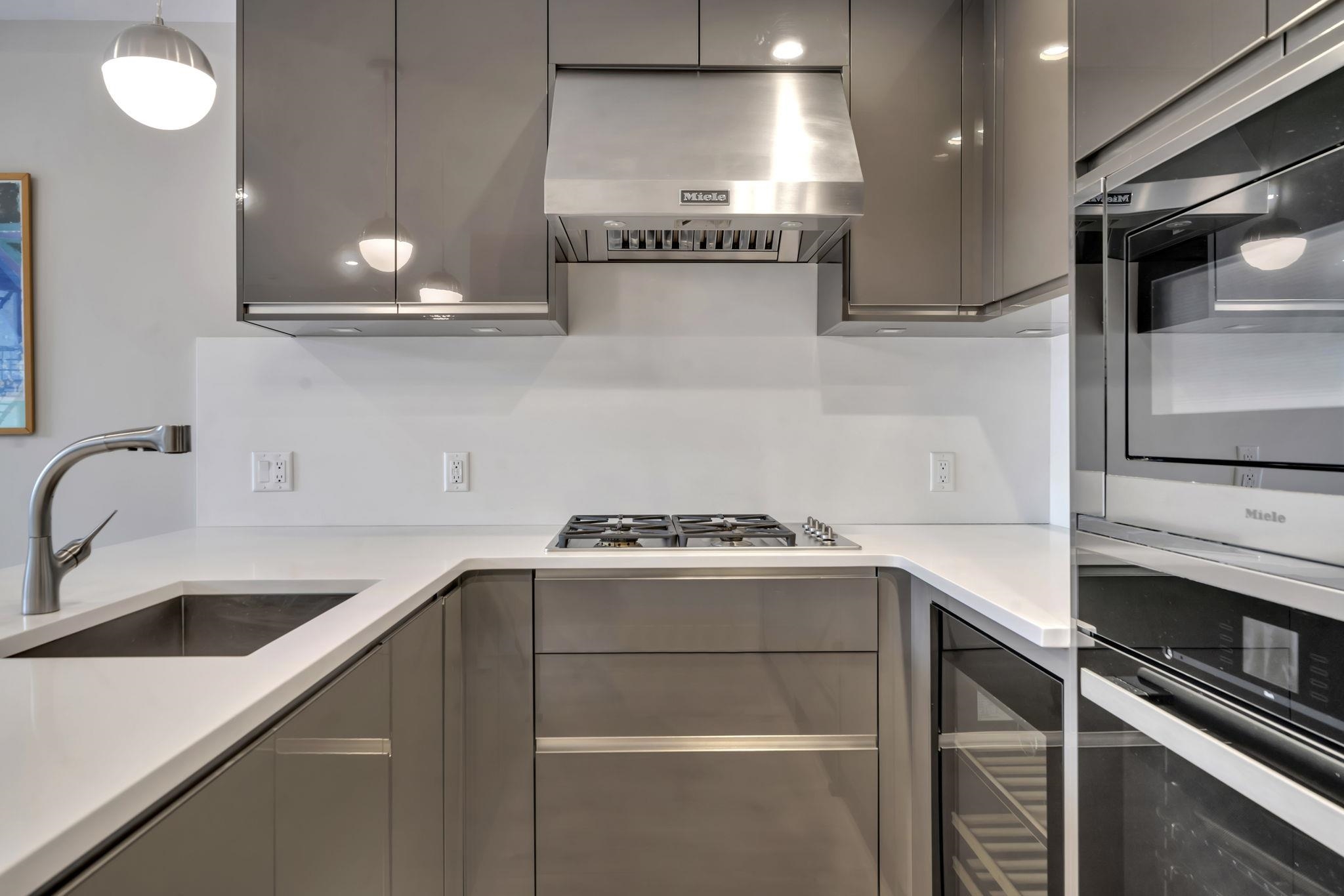 61 14th Street, Unit 3 Hoboken, NJ 07030 - Photo 13 of 31 a kitchen with a sink and cabinets
