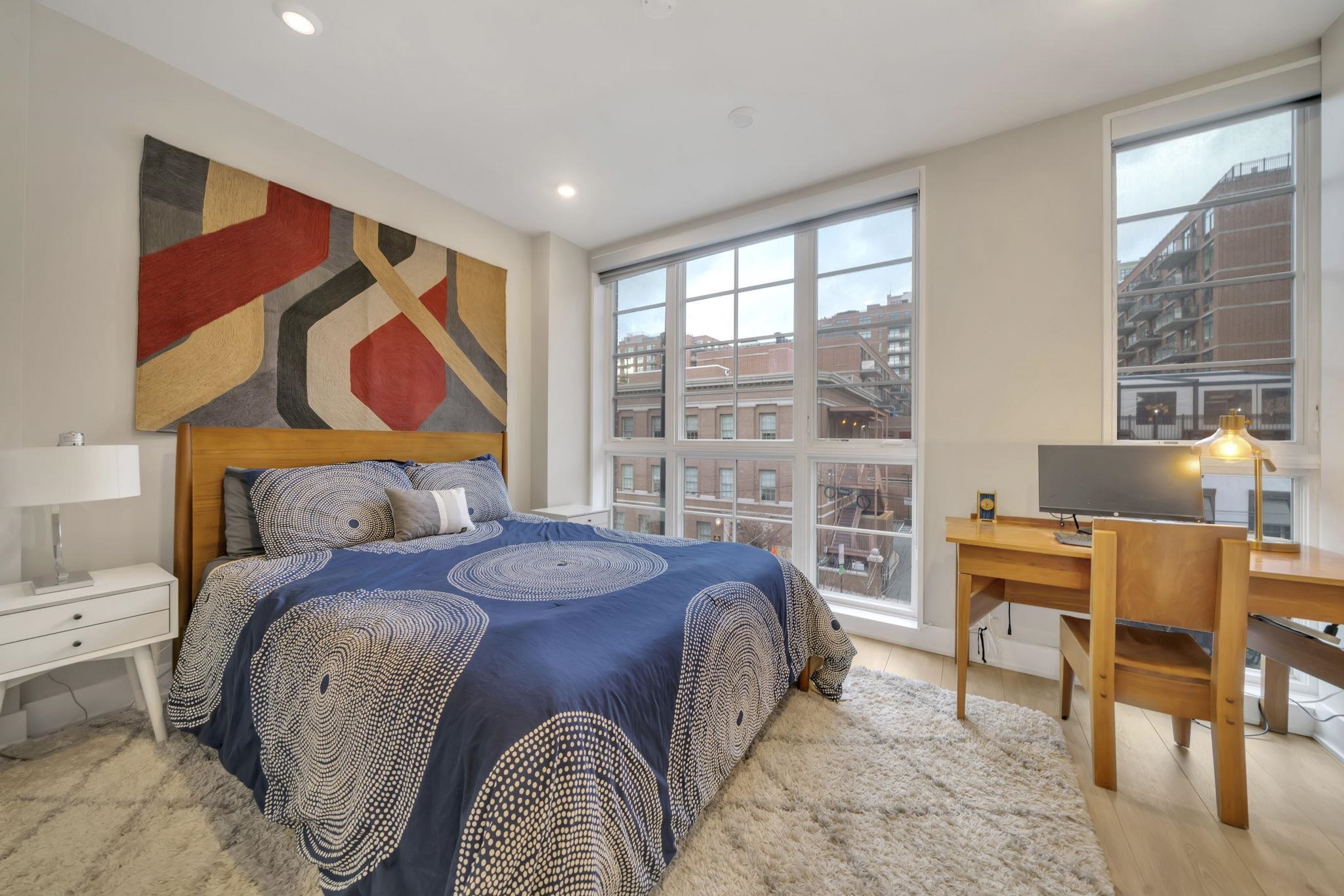 61 14th Street, Unit 3 Hoboken, NJ 07030 - Photo 16 of 31 a bedroom with a bed and a table
