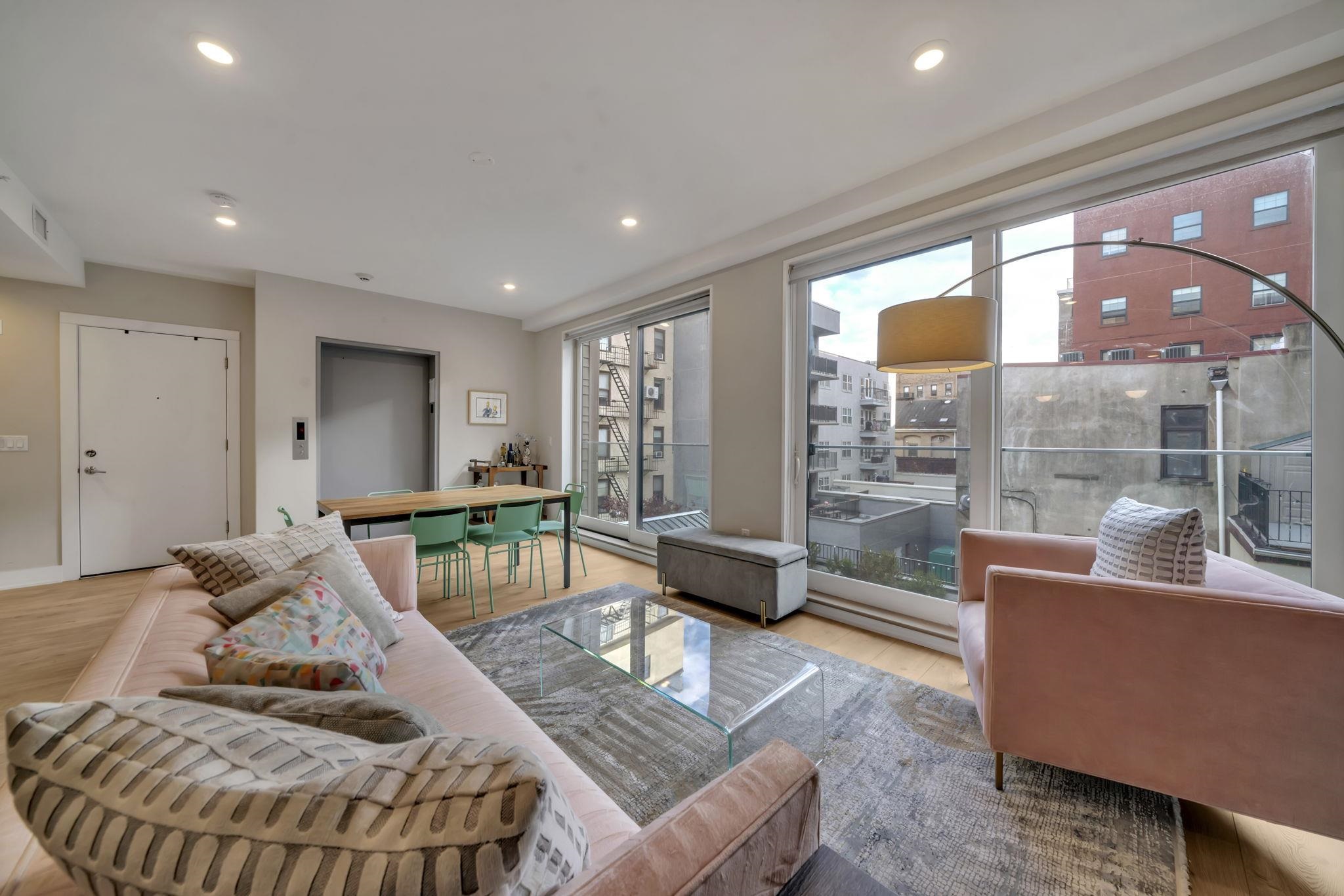61 14th Street, Unit 3 Hoboken, NJ 07030 - Photo 4 of 31 a living room with furniture and a large window