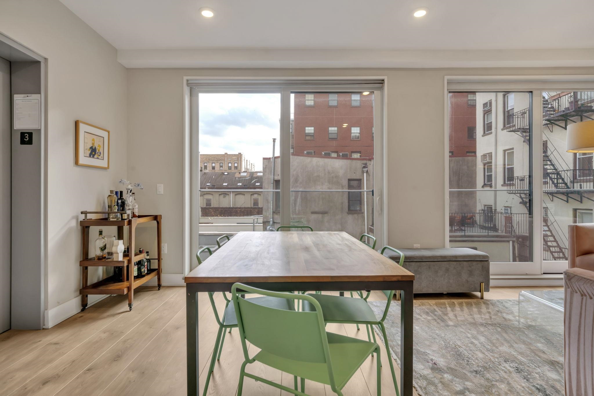 61 14th Street, Unit 3 Hoboken, NJ 07030 - Photo 6 of 31 a living room with furniture and a window