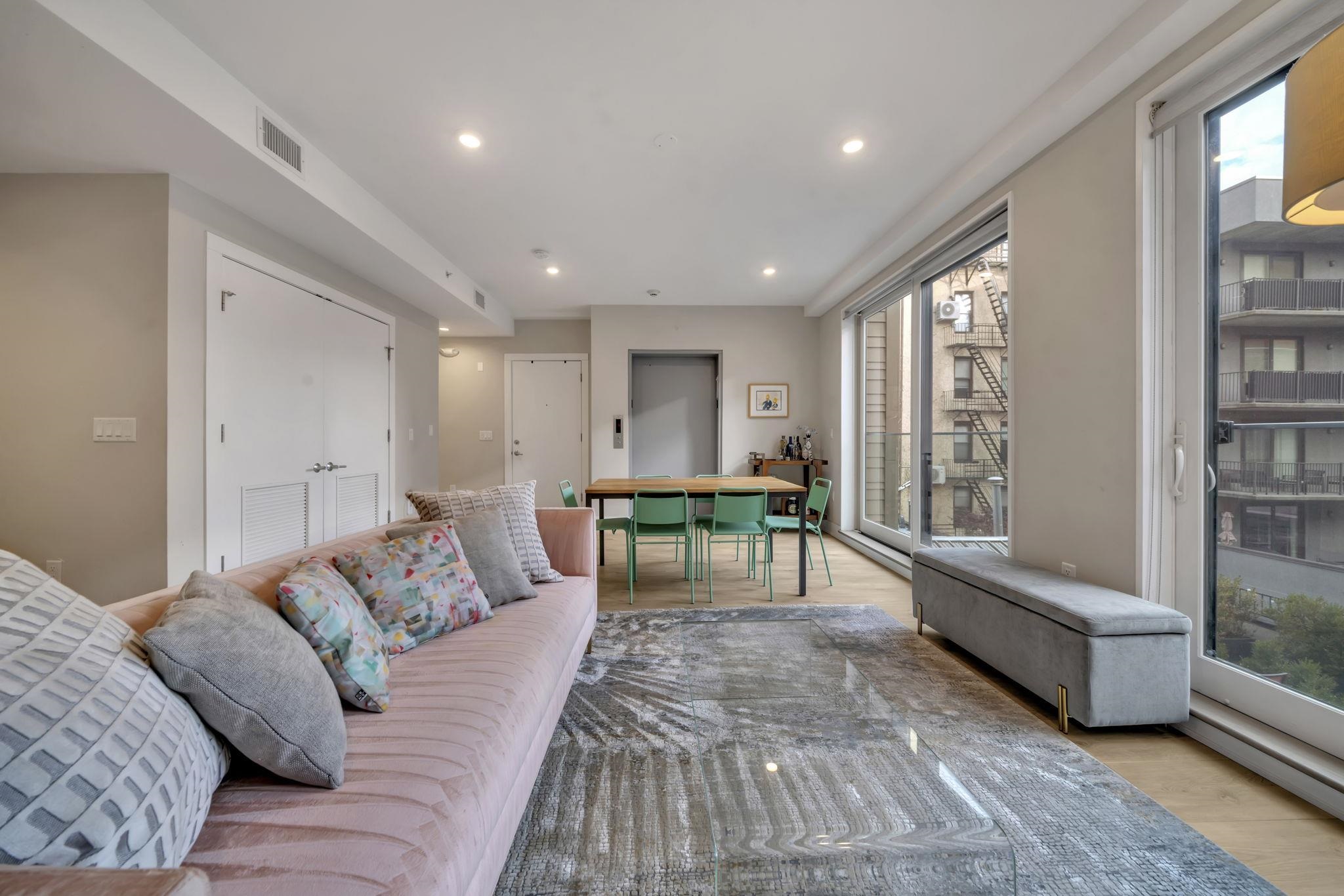 61 14th Street, Unit 3 Hoboken, NJ 07030 - Photo 8 of 31 a living room with furniture and a rug