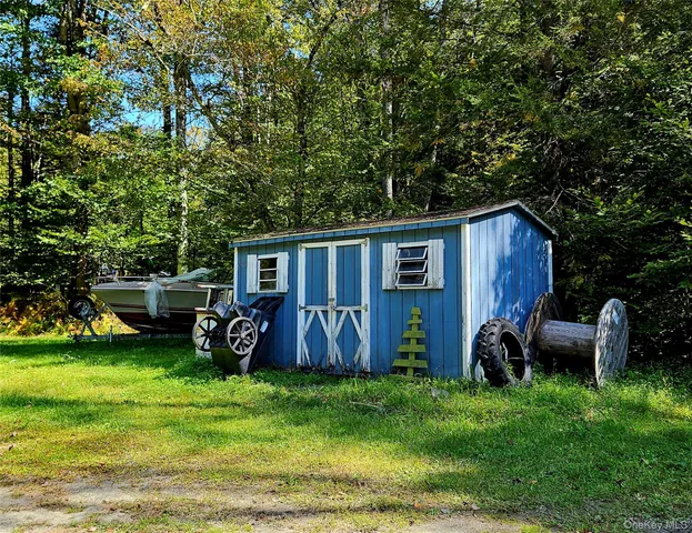 a view of backyard of house with seating space