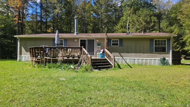 a view of a backyard with a car parked in it