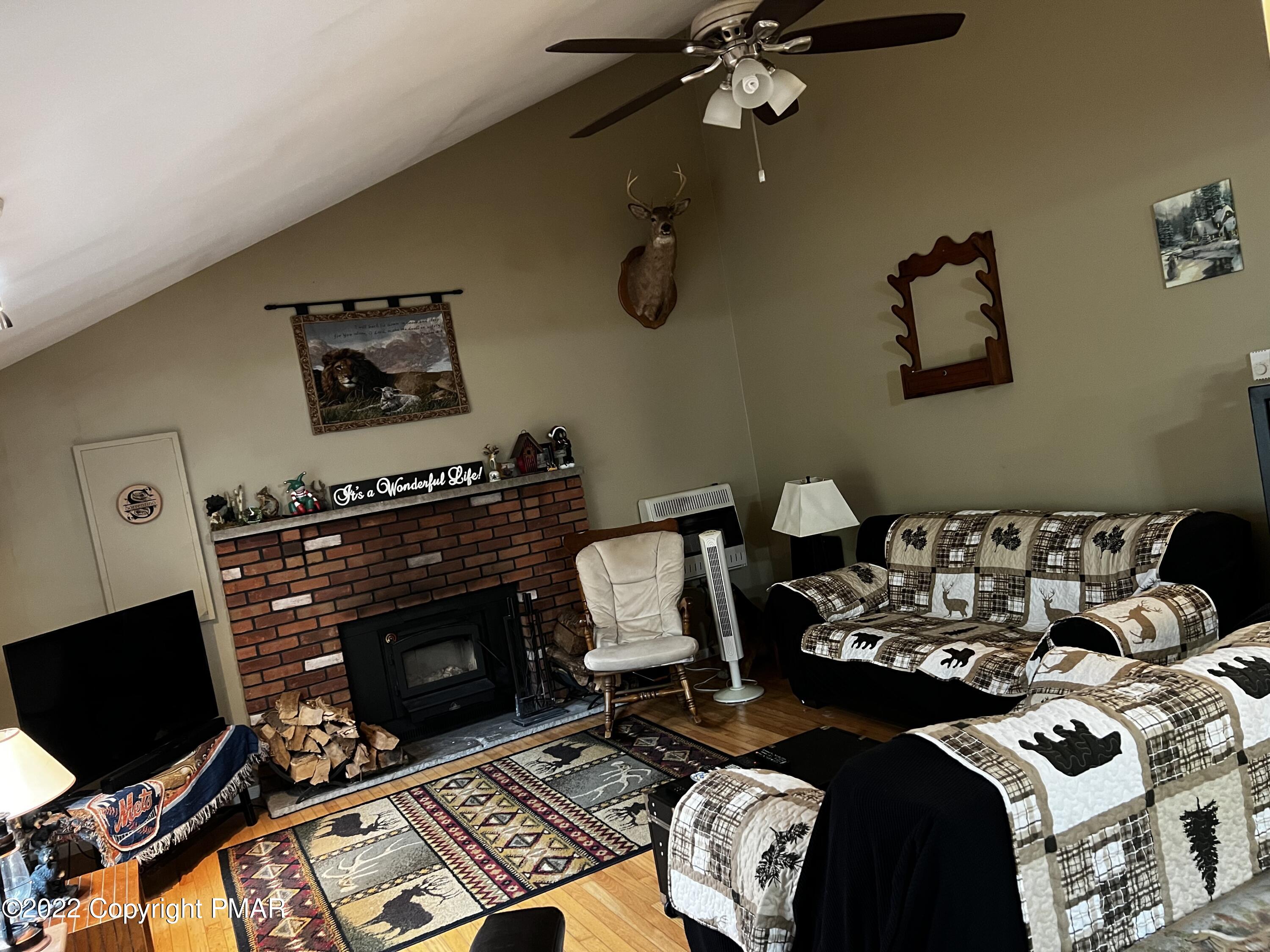 153 Edinburgh Road Bushkill, PA 18324 - Photo 3 of 24 a bedroom with a bed and a television