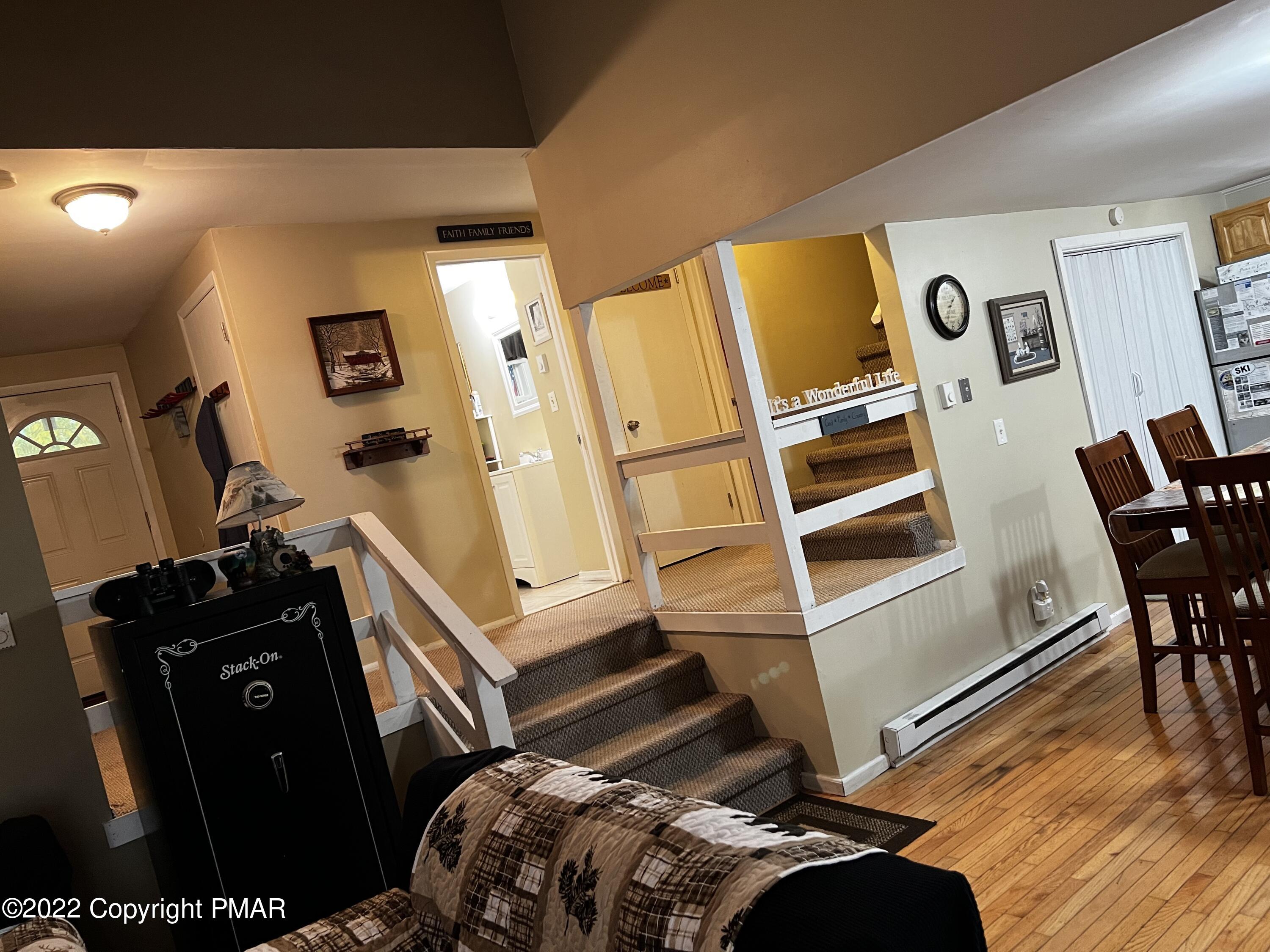 153 Edinburgh Road Bushkill, PA 18324 - Photo 5 of 24 a bedroom with a bed and furniture