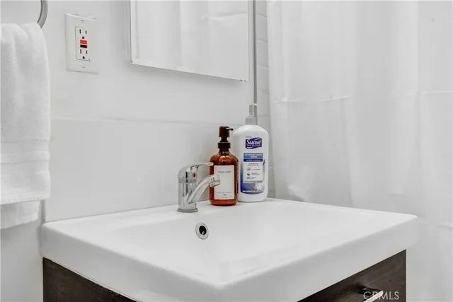 a bathroom with a sink and vanity