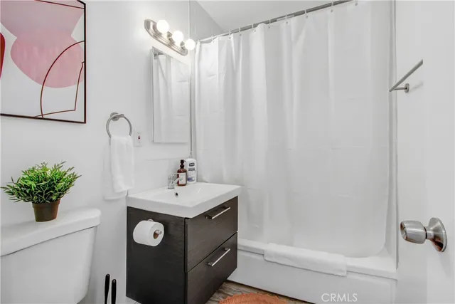 a bathroom with a sink a mirror and a shower
