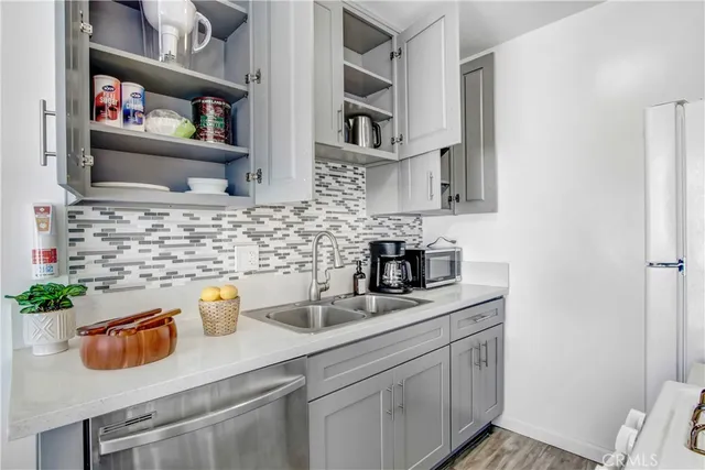 a kitchen with a sink and cabinets