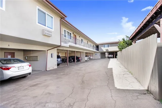 a view of a car park with a car parked in front of it