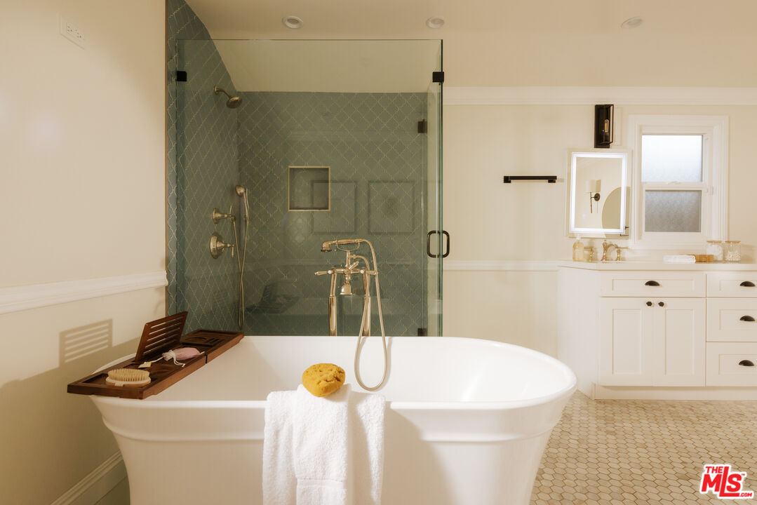 11630 Bellagio Road Los Angeles, CA 90049 - Photo 11 of 18 a bathroom with a sink and a mirror