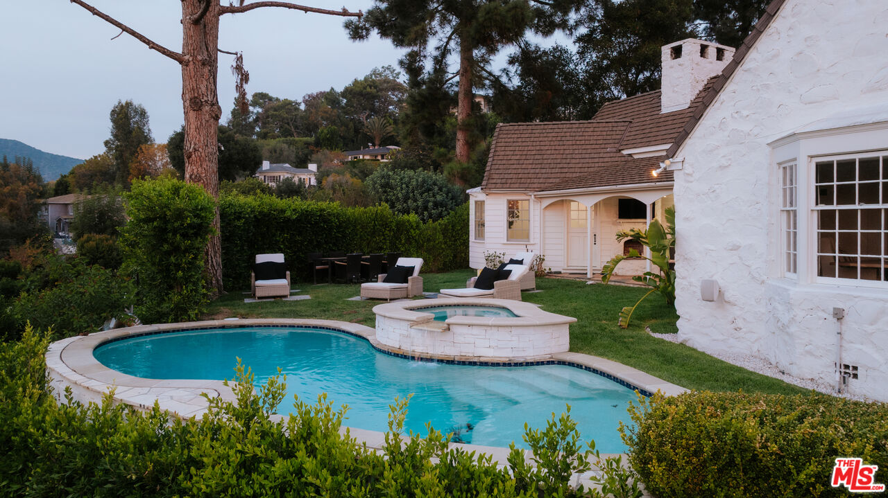 11630 Bellagio Road Los Angeles, CA 90049 - Photo 15 of 18 a view of a swimming pool with a patio