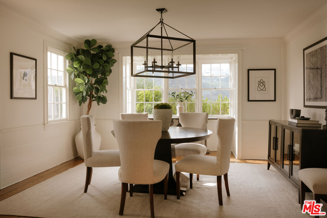 11630 Bellagio Road Los Angeles, CA 90049 - Photo 4 of 18 a view of a dining room with furniture window and outside view