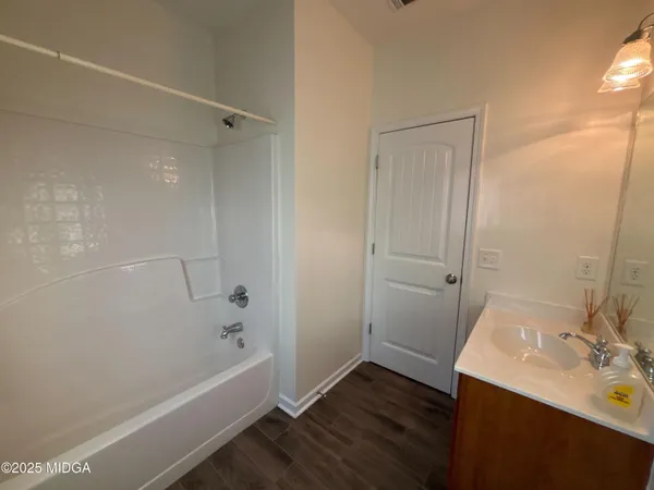 a bathroom with a sink and a bathtub