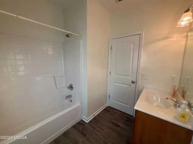 a bathroom with a sink and a bathtub