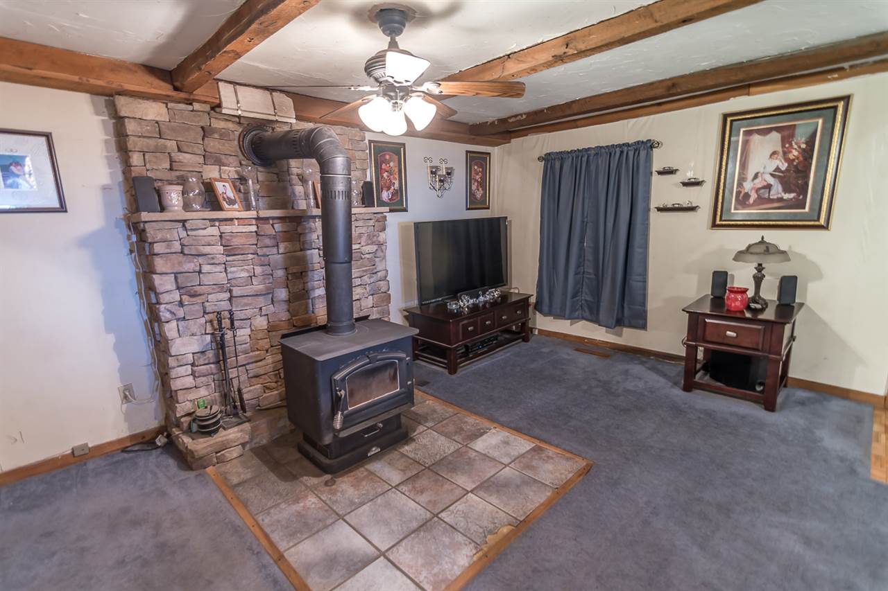 3672 Middlebrook Village Road Middlebrook, VA 24459 - Photo 23 of 45 a living room with furniture a flat screen tv and a wall painting