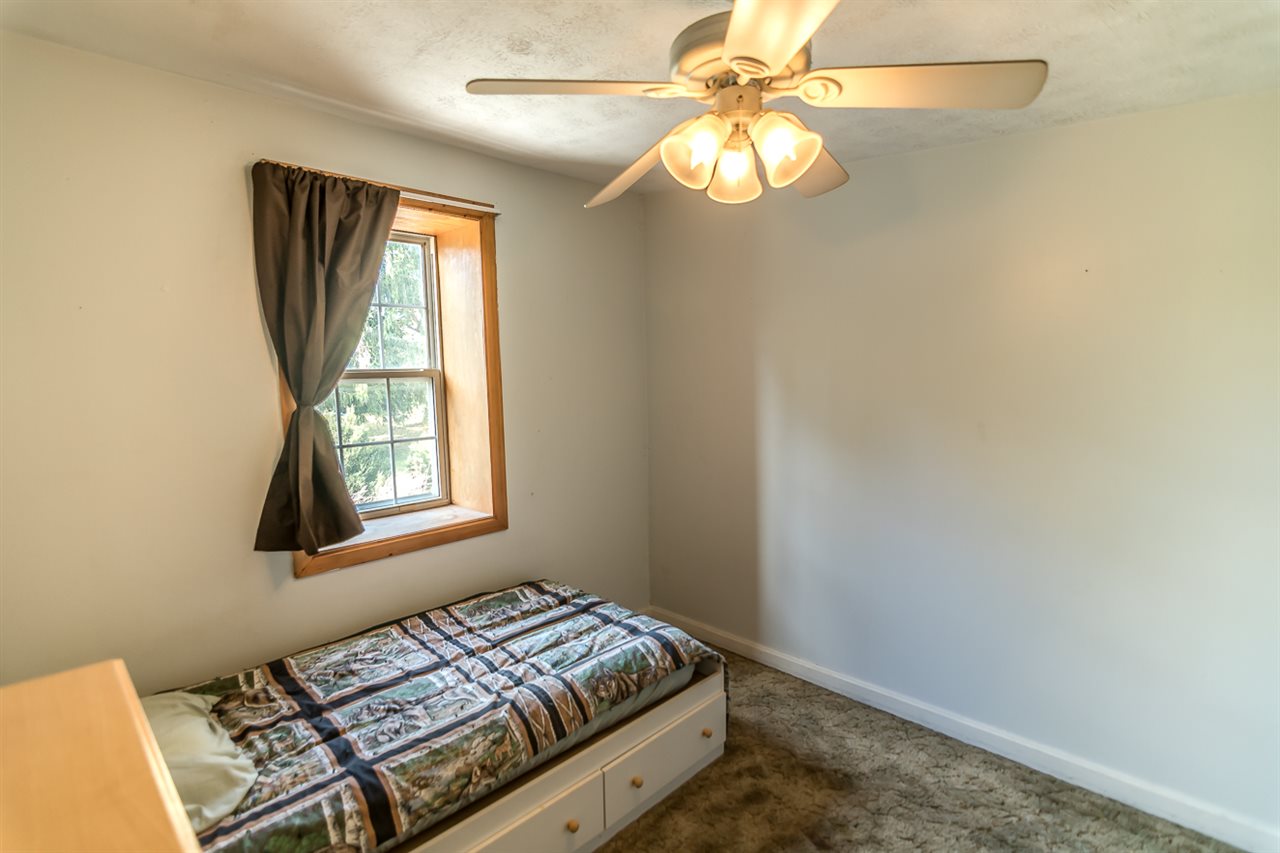 3672 Middlebrook Village Road Middlebrook, VA 24459 - Photo 31 of 45 a bedroom with a bed and a window