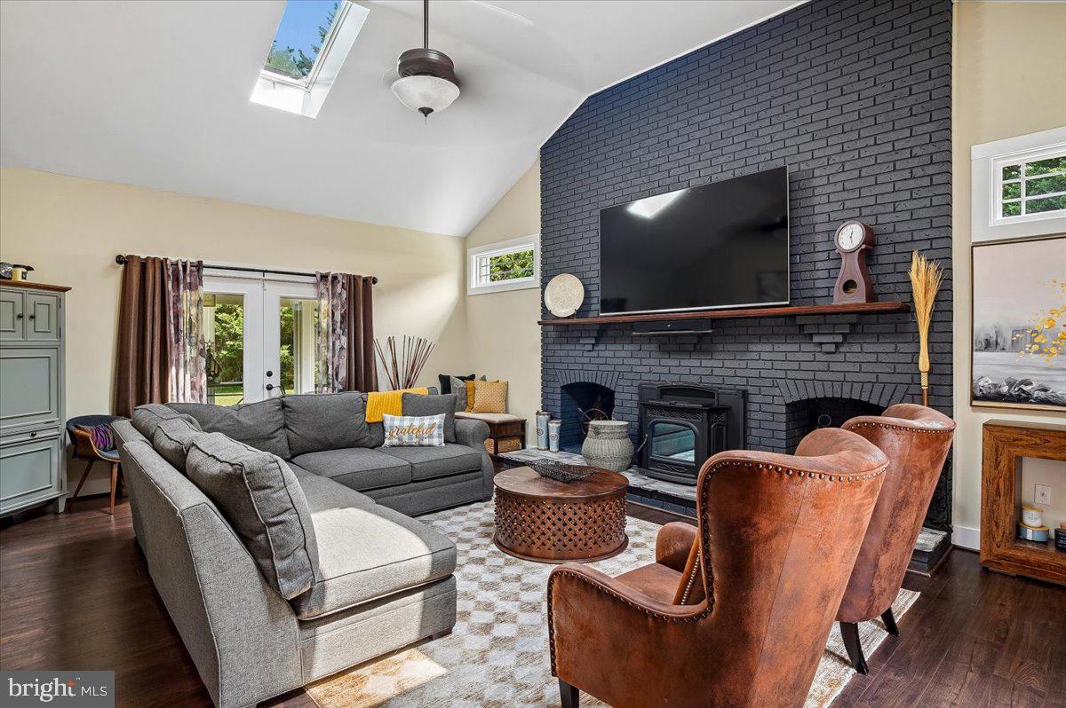 6271 Solomons Island Road Tracys Landing, MD 20779 - Photo 12 of 42 Family room with fireplace & view of sunroom