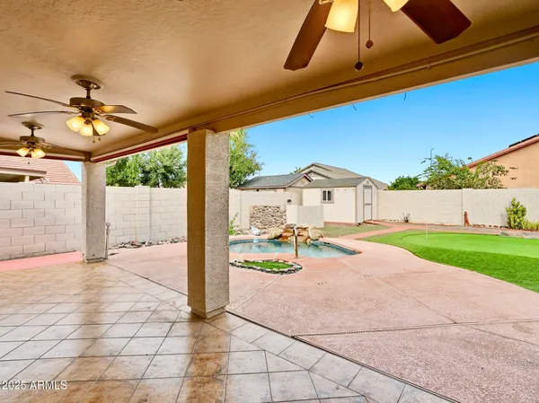 a view of swimming pool with a yard