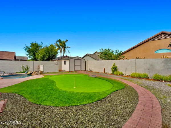 a view of a swimming pool with a yard